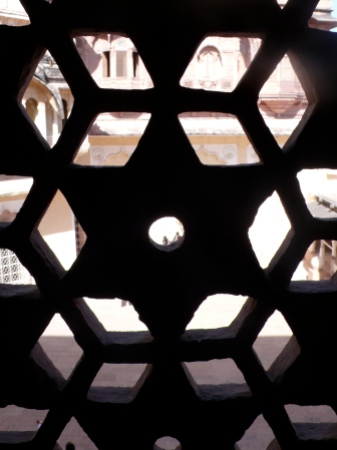 We went into the palaces and I was able to peep through the carved lattice-like stone and see the court below